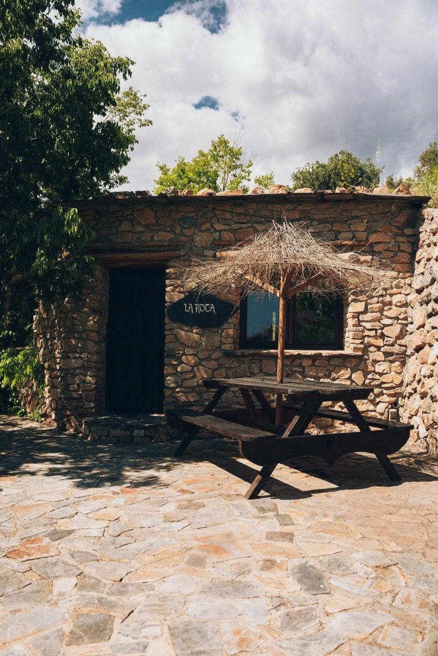 La Roca — The door, a table in the shade