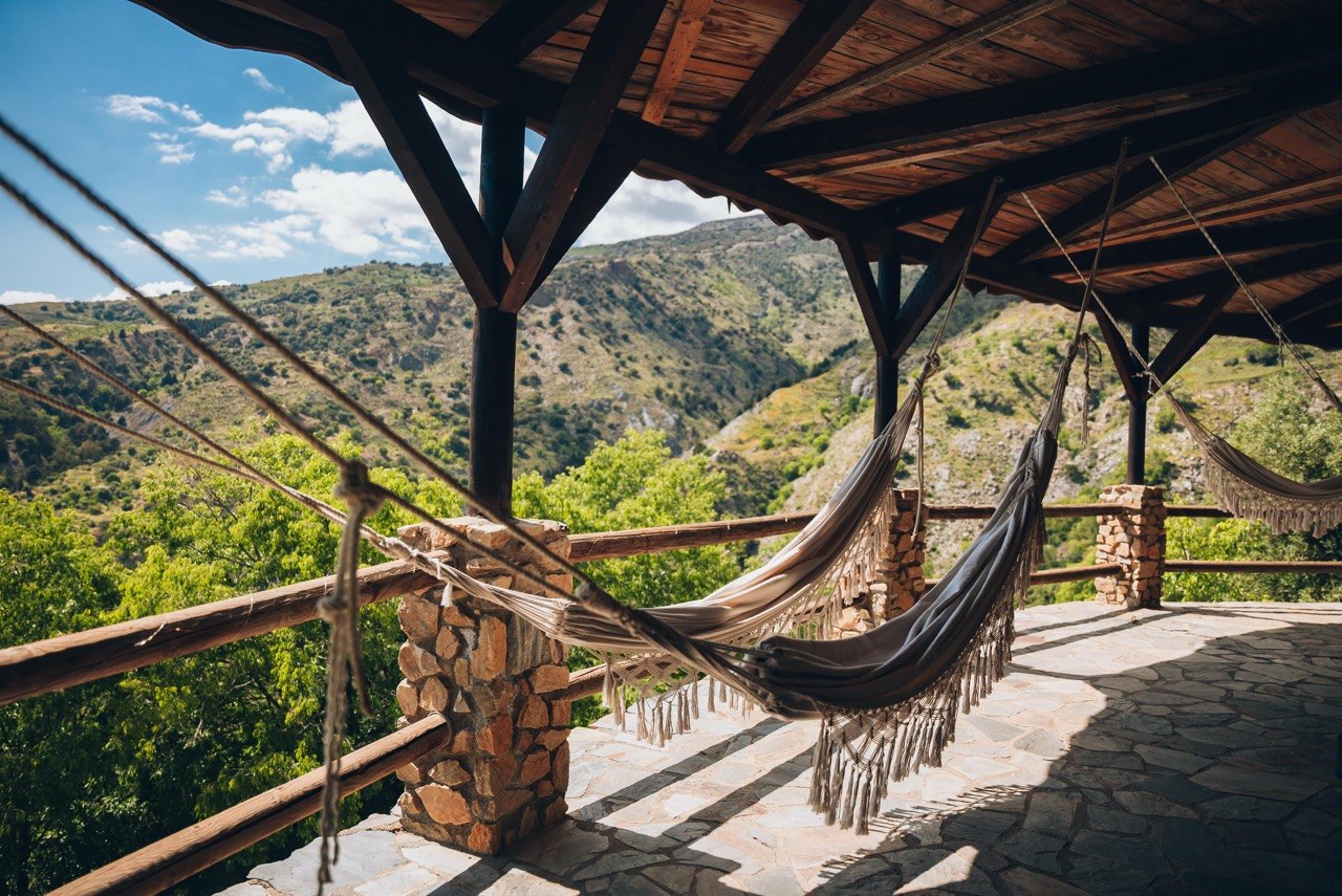 Hammocks on the covered terrace, the valley below