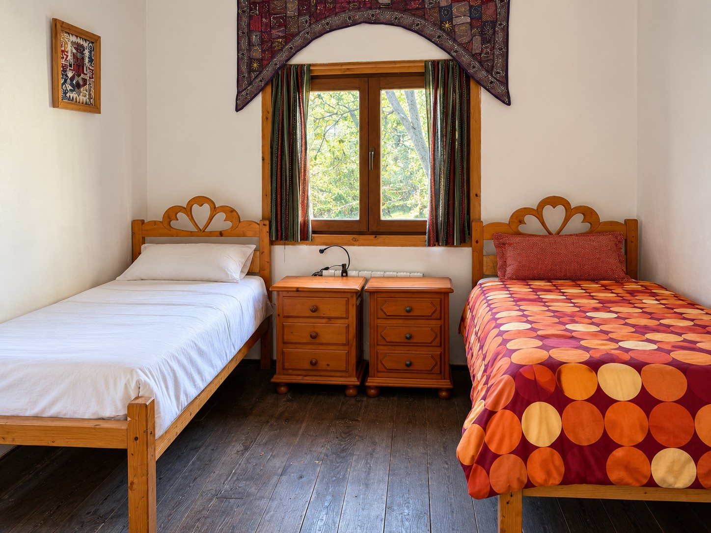 A twin room, the trees at the window