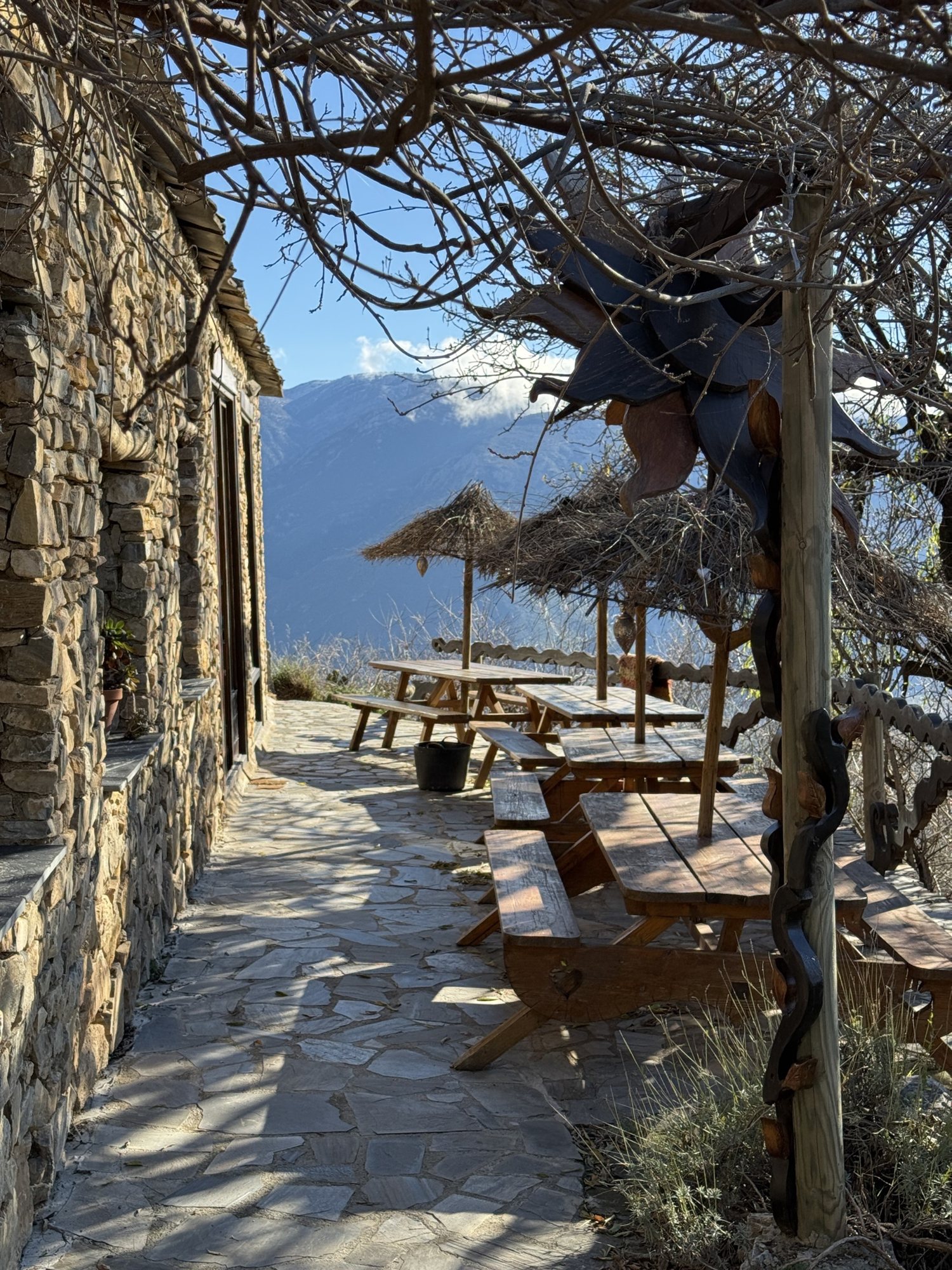 Long tables on the terrace, the mountains beyond