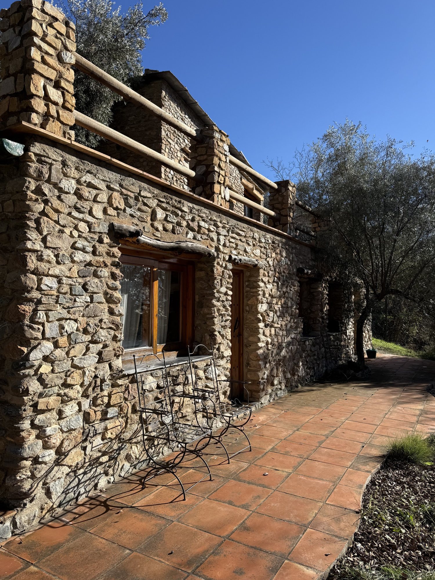 A stone house and its terracotta path